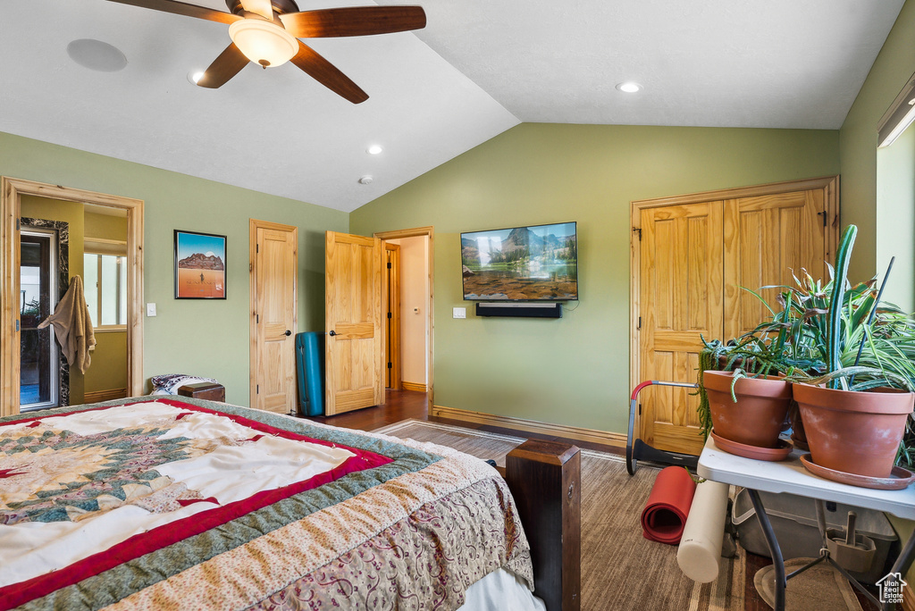 Bedroom with wood-type flooring, ceiling fan, and lofted ceiling