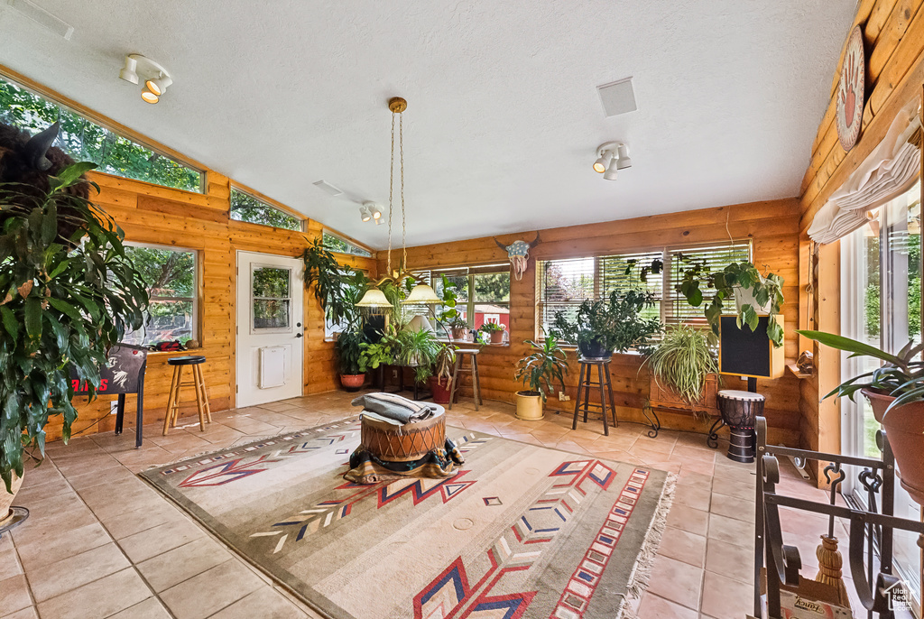 Sunroom with vaulted ceiling