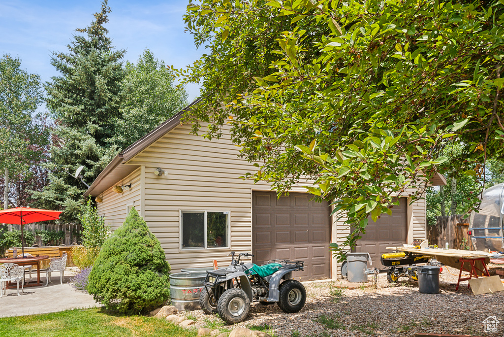 Back of house with a garage