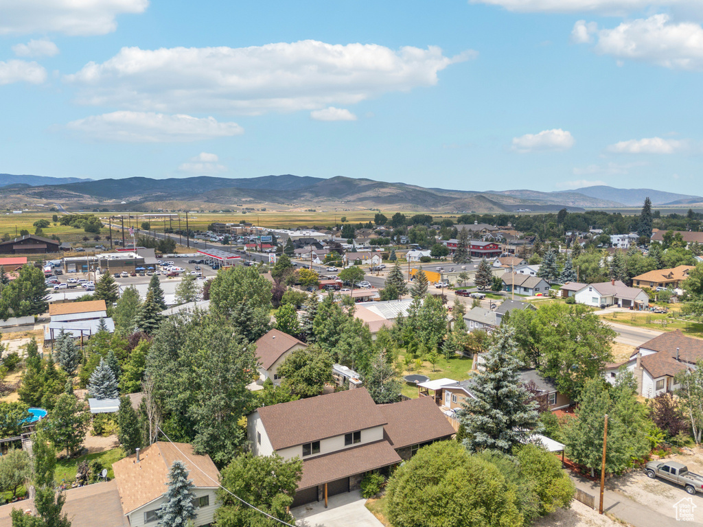 Birds eye view of property with a mountain view