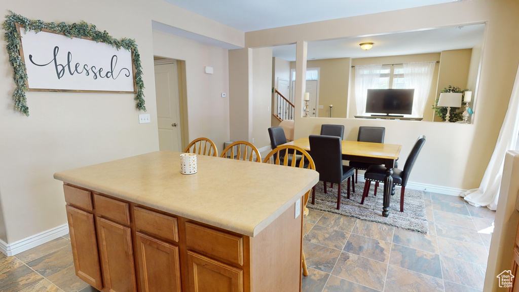 Kitchen featuring tile patterned flooring and a center island