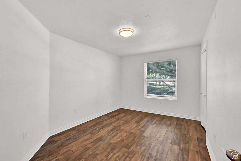 Spare room with hardwood / wood-style flooring