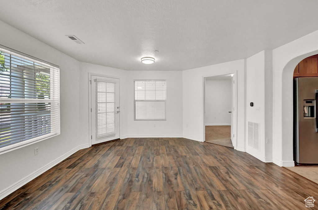 Interior space with dark hardwood / wood-style flooring