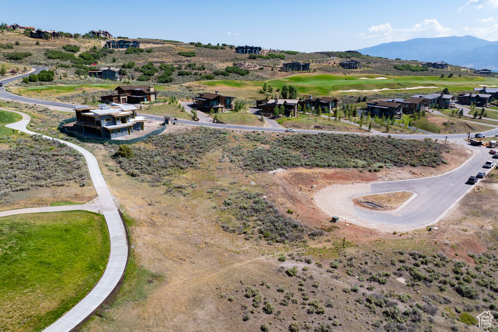 Birds eye view of property with a mountain view