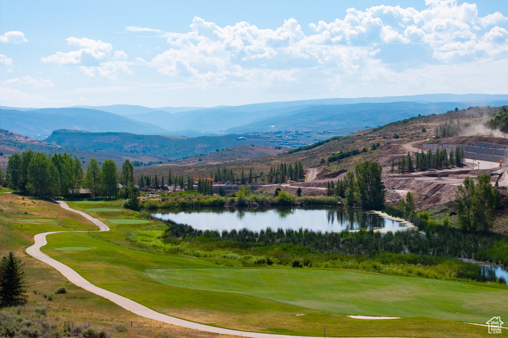 View of home's community featuring a water and mountain view