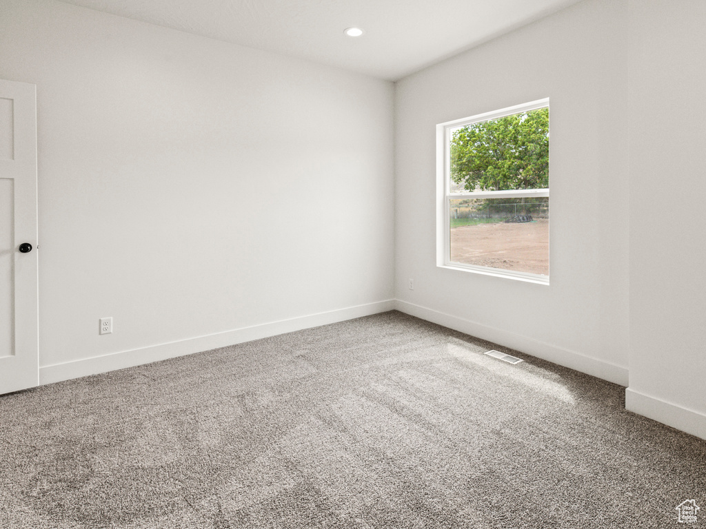 Unfurnished room featuring carpet