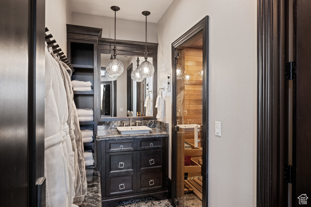 Bathroom with tile patterned flooring and vanity