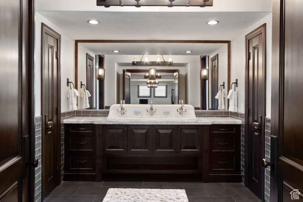 Bathroom with vanity and tile patterned floors