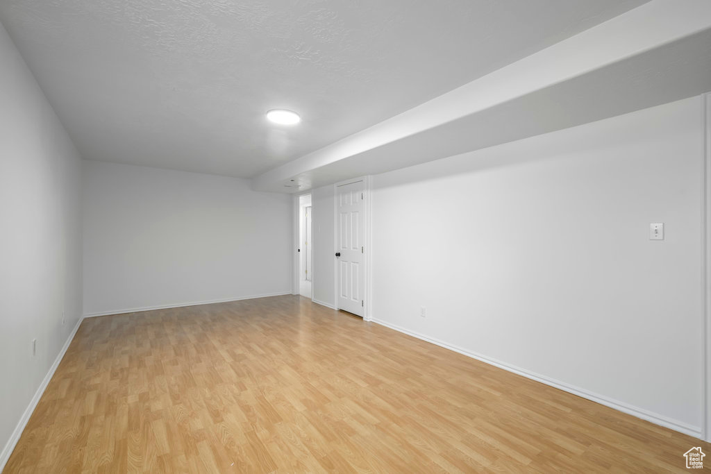 Unfurnished room with light hardwood / wood-style floors