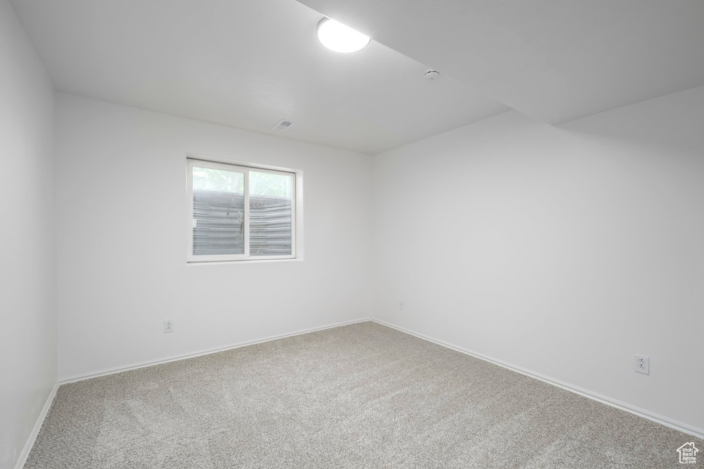 Empty room with carpet floors