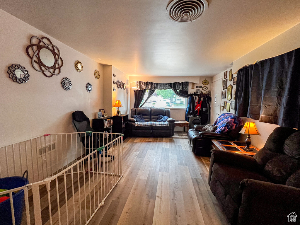 Living room with hardwood / wood-style floors