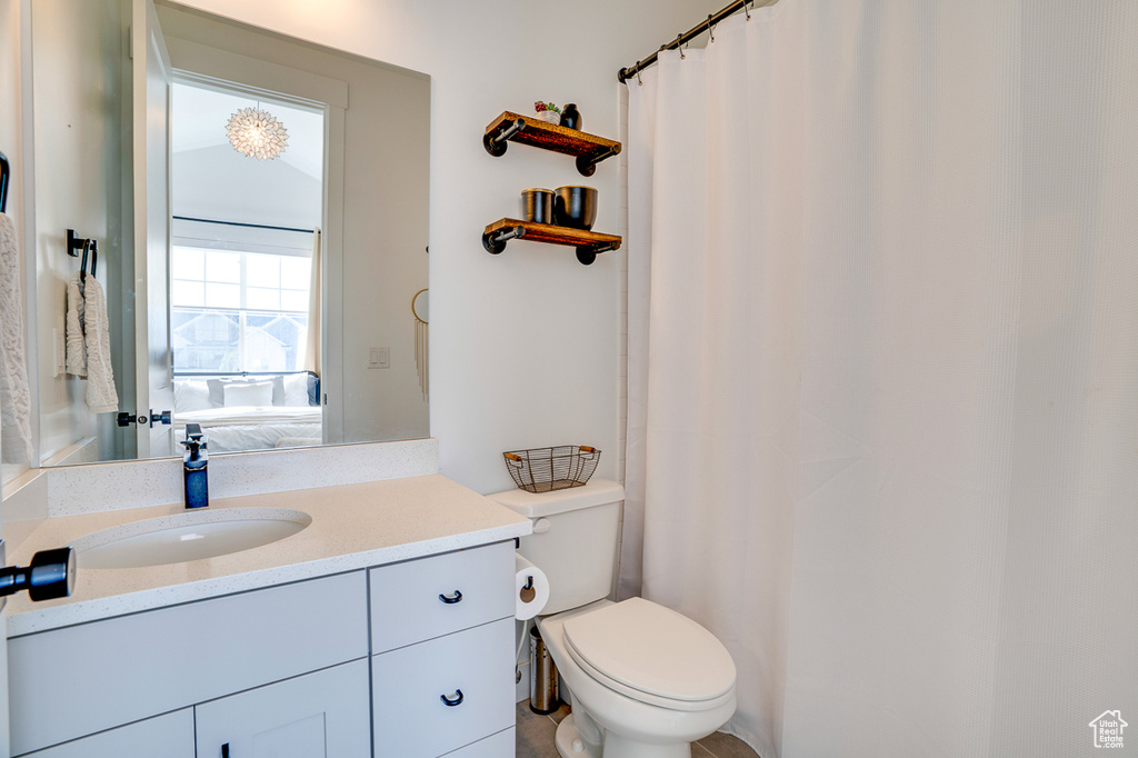 Bathroom featuring vanity and toilet