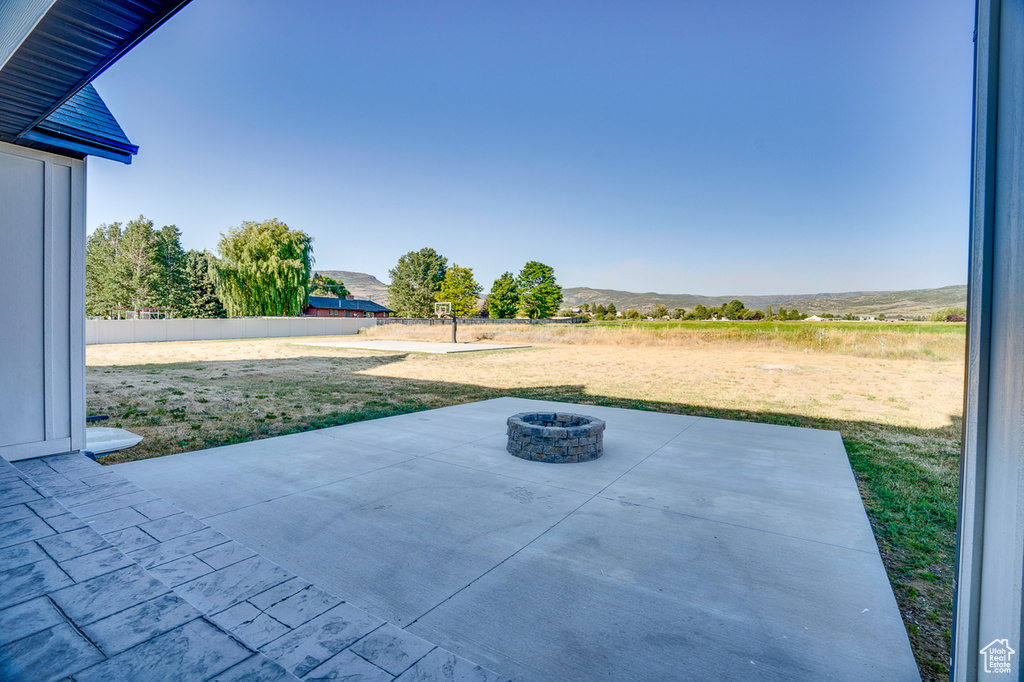 View of patio / terrace with an outdoor fire pit