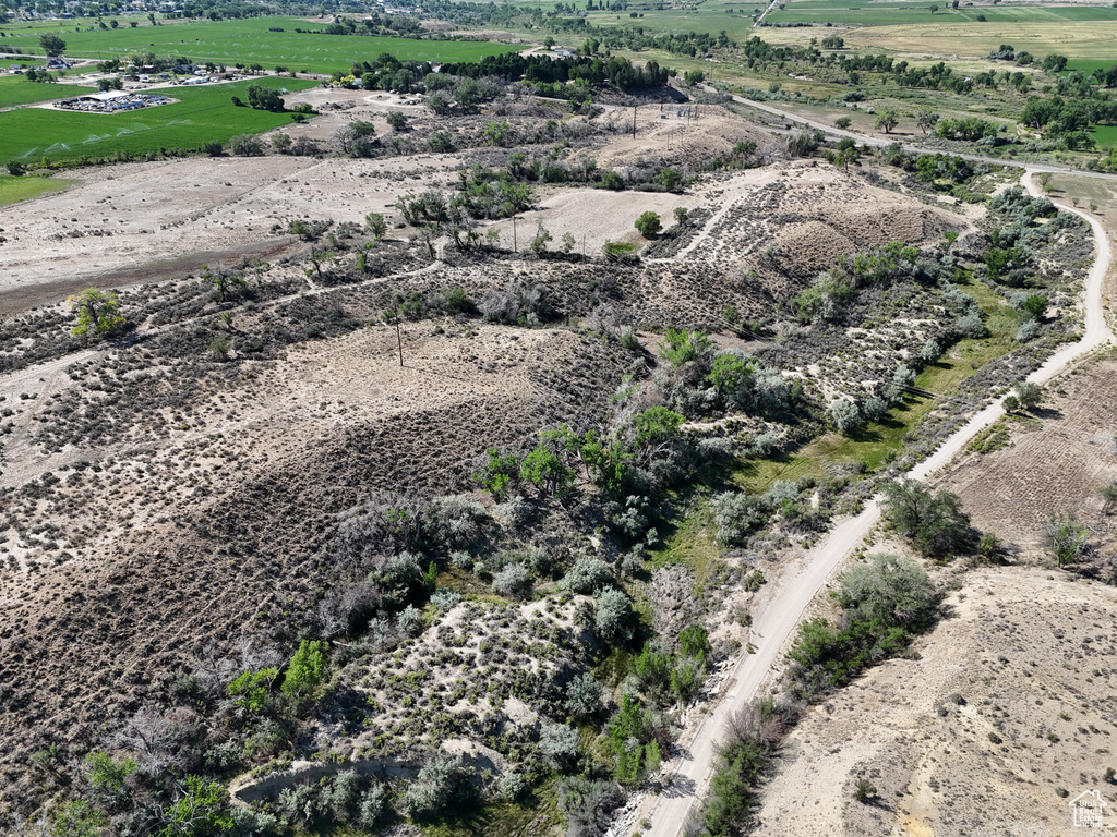 Birds eye view of property featuring a rural view