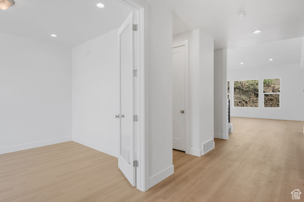 Hallway featuring light hardwood / wood-style floors