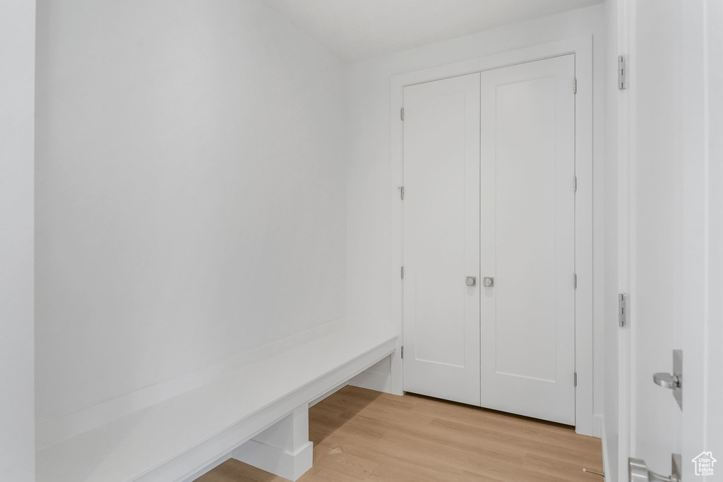 Mudroom with light hardwood / wood-style flooring