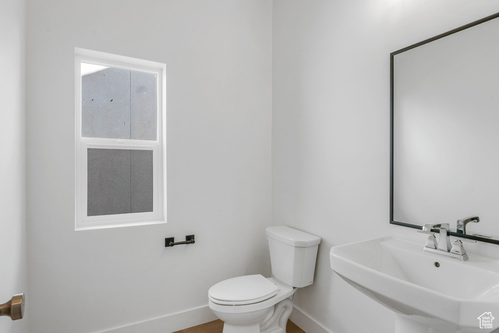 Bathroom featuring sink and toilet