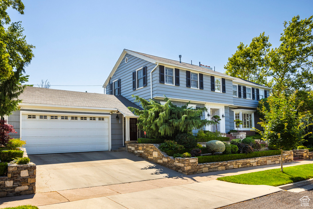 View of front of property with a garage