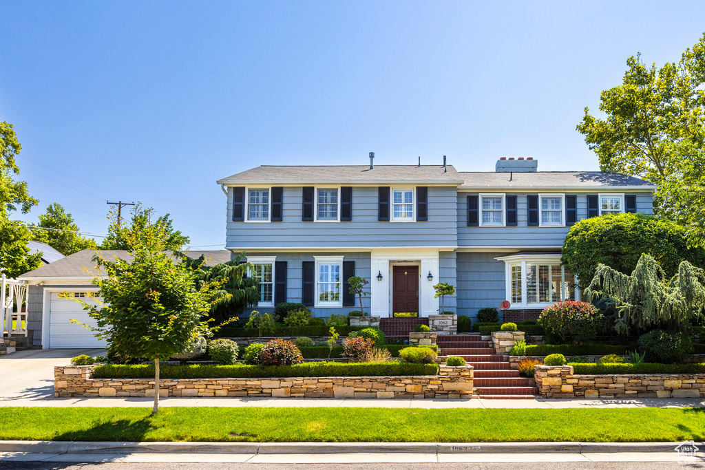 View of front of property featuring a garage