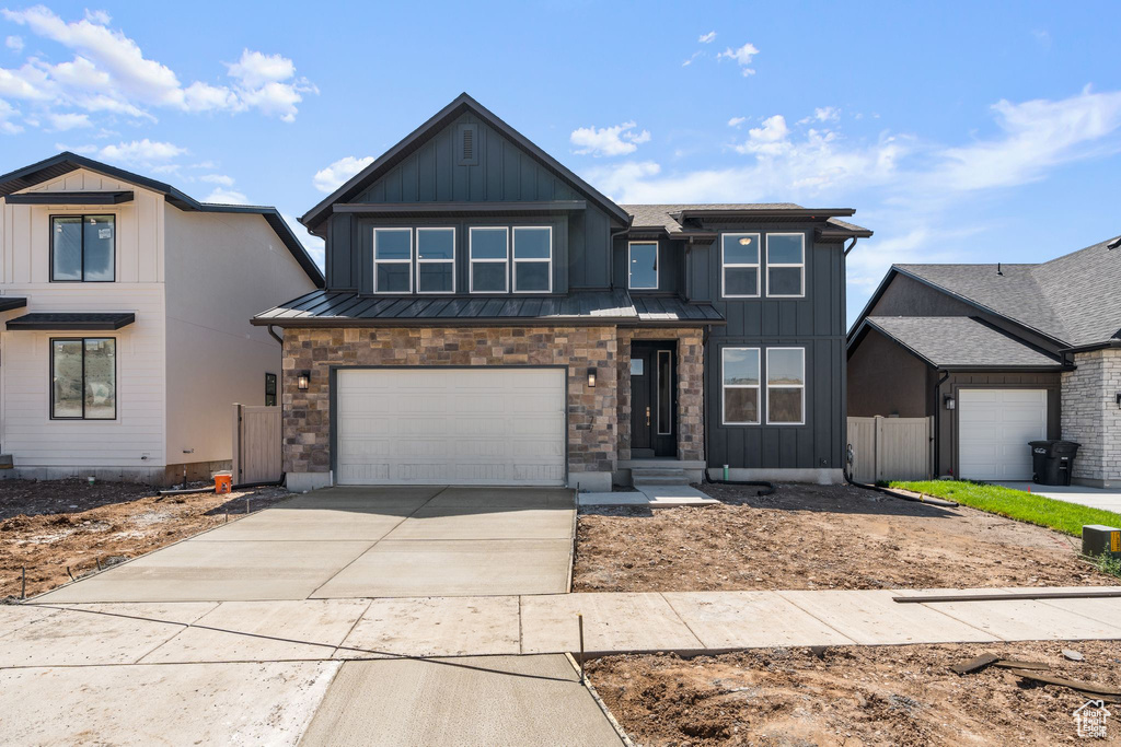 View of front of property featuring a garage