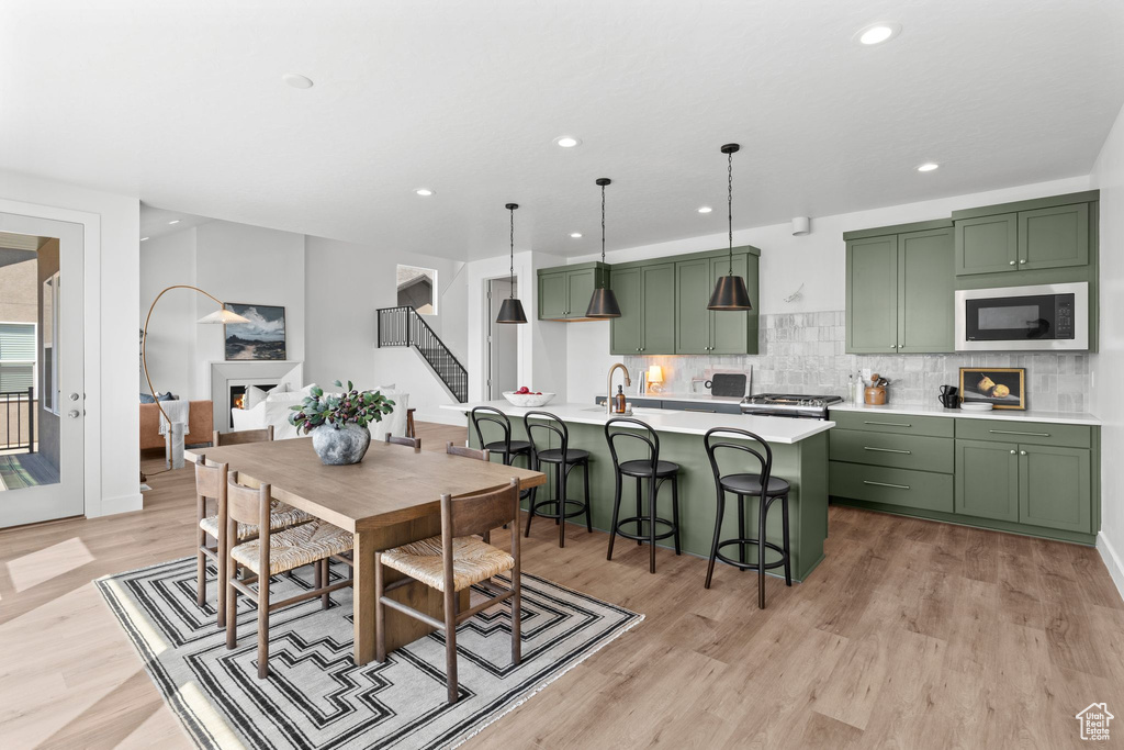 Dining room featuring light hardwood / wood-style floors and sink