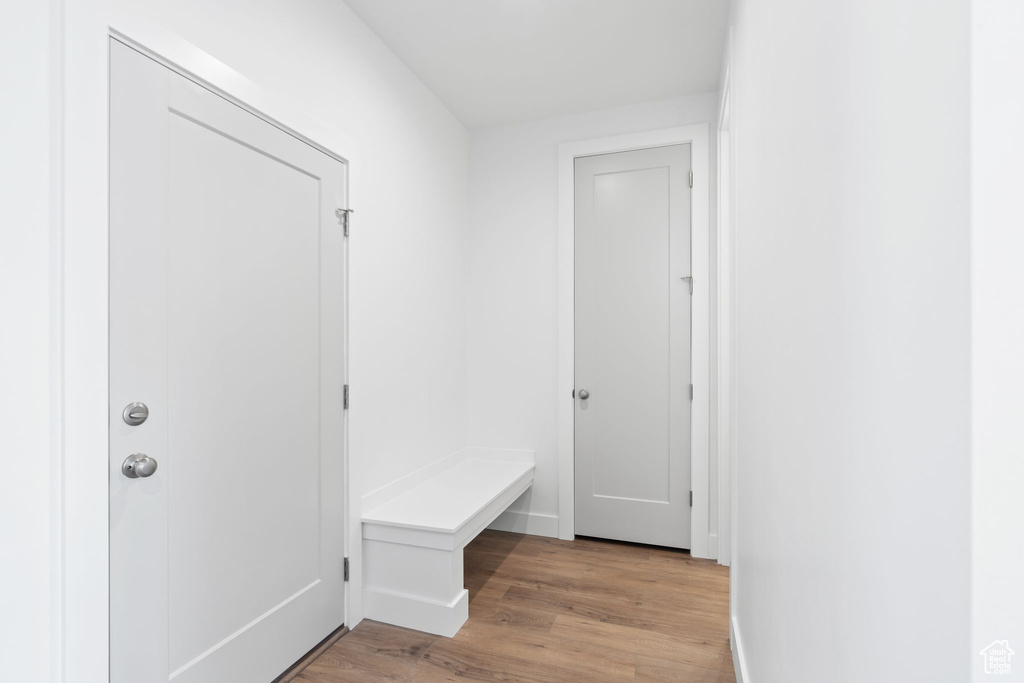 Mudroom with light hardwood / wood-style floors