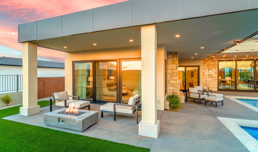 Patio terrace at dusk with a fire pit