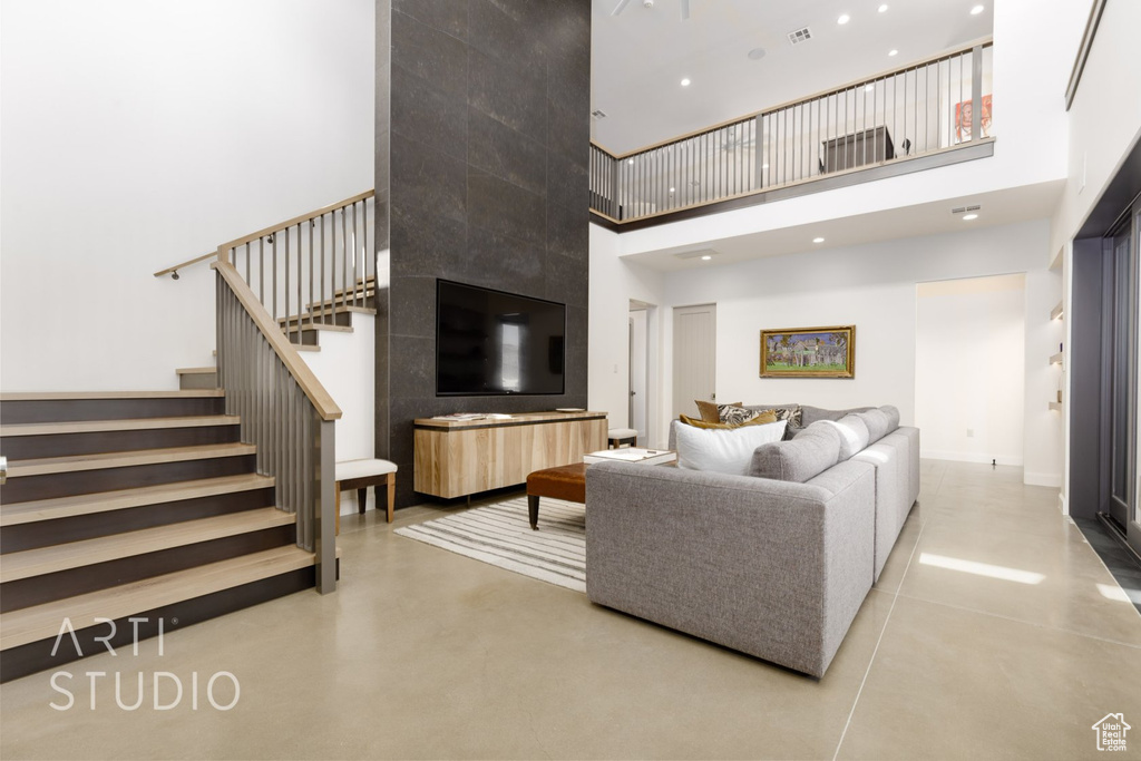 Living room featuring a towering ceiling