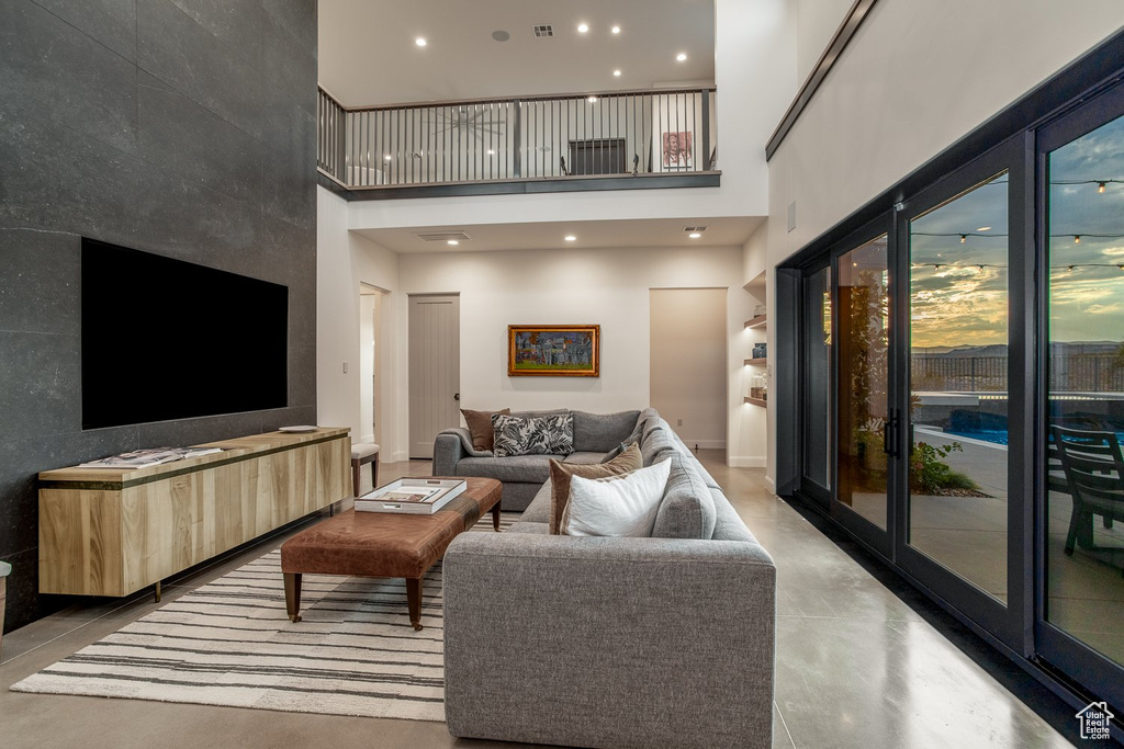 Living room featuring a towering ceiling