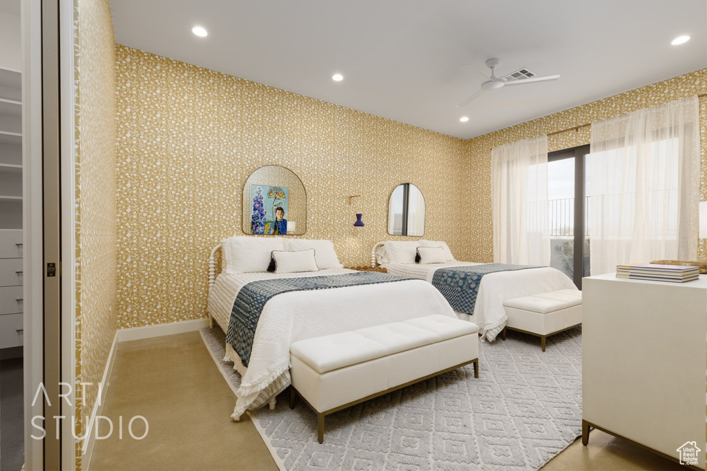 Carpeted bedroom with ceiling fan