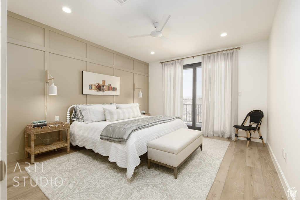 Bedroom with light hardwood / wood-style floors and ceiling fan