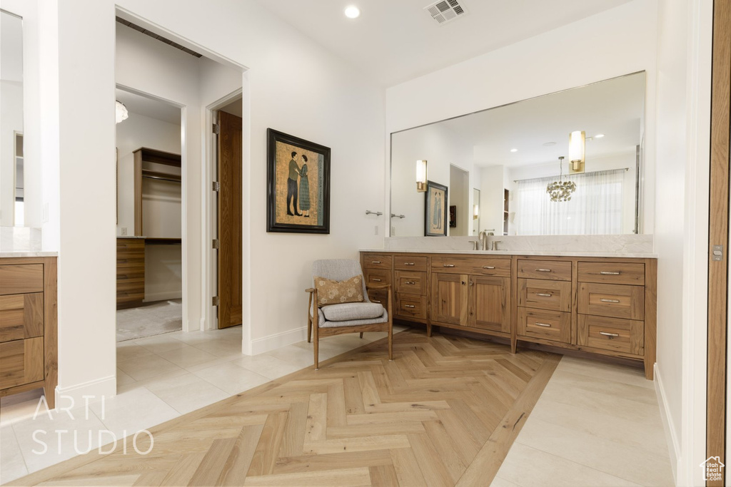 Bathroom with vanity and parquet flooring