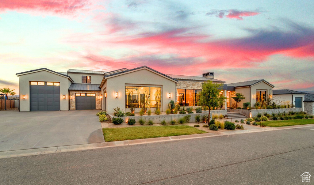 View of front of property featuring a garage