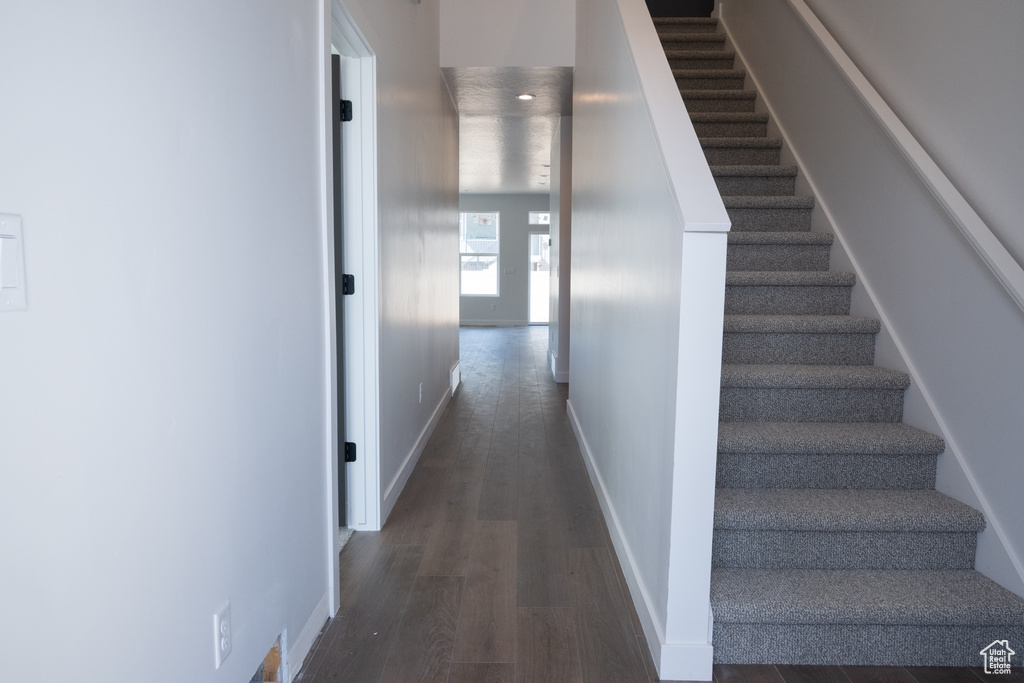 Interior space featuring dark wood-type flooring