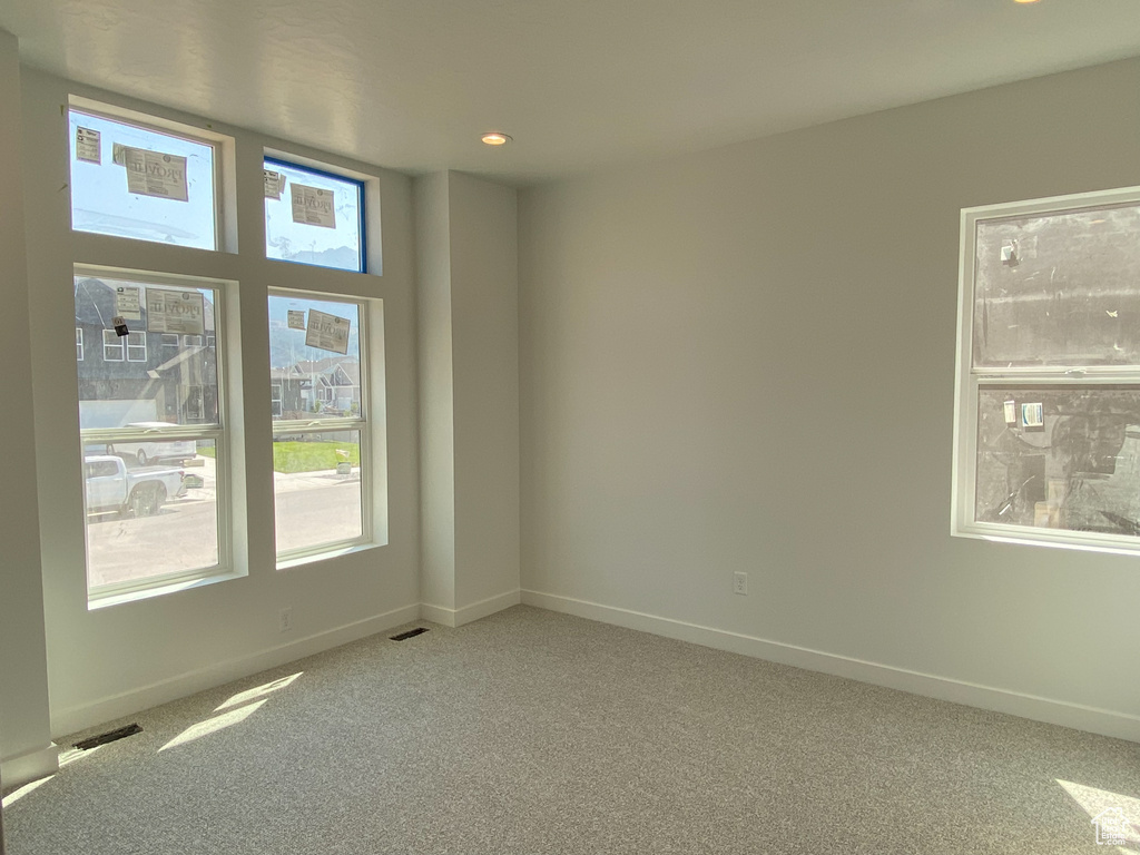 Spare room featuring carpet floors