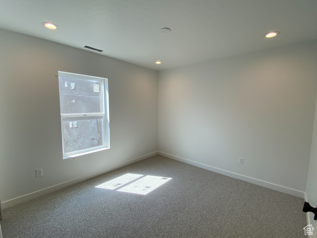 View of carpeted spare room