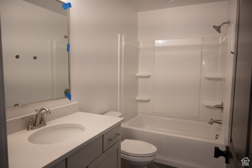 Full bathroom with bathtub / shower combination, tile patterned floors, toilet, and vanity