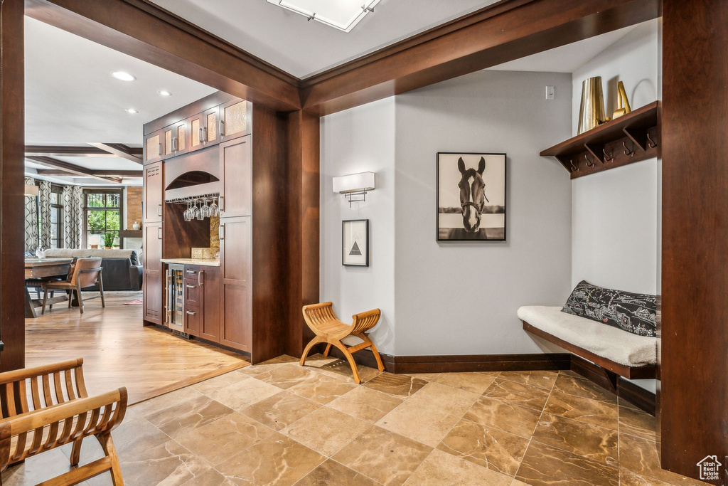 Interior space with light hardwood / wood-style floors and beverage cooler