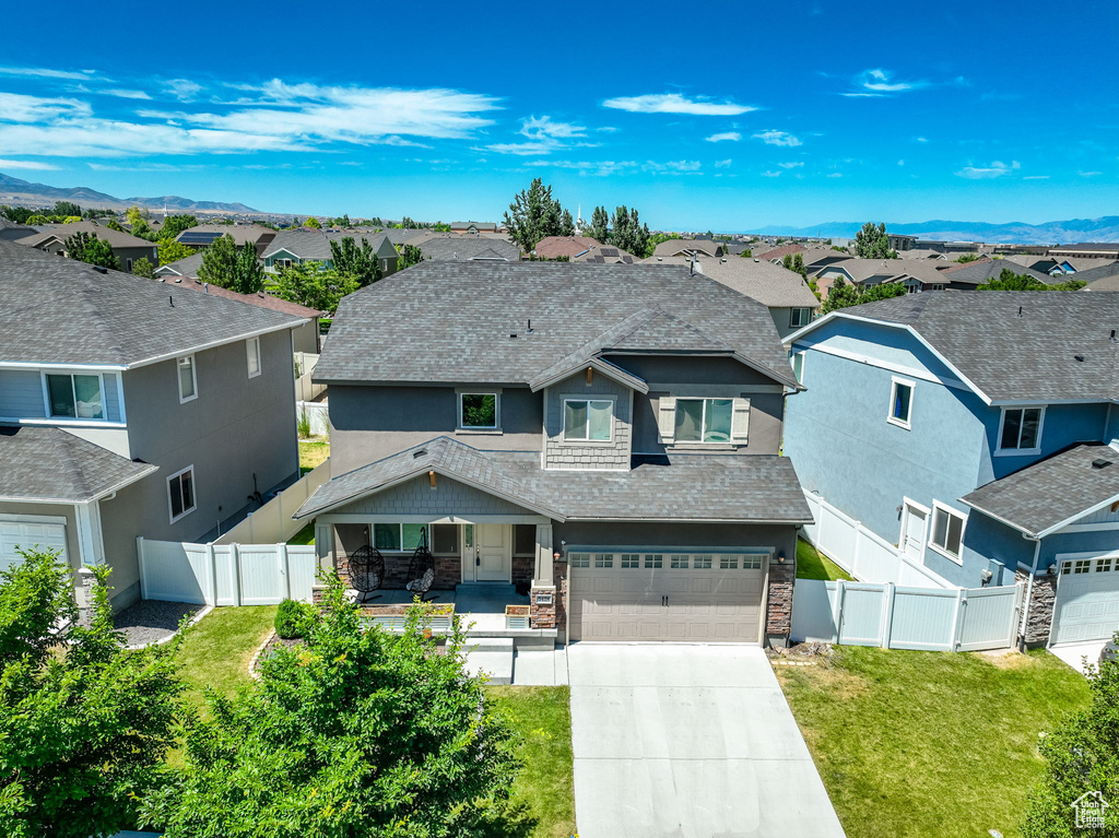 View of front of house featuring a garage and a mountain view