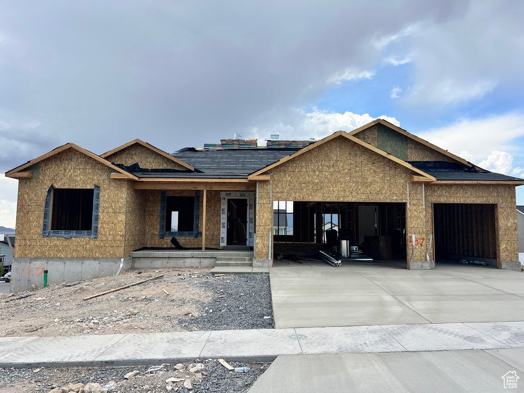 Property in mid-construction with a garage