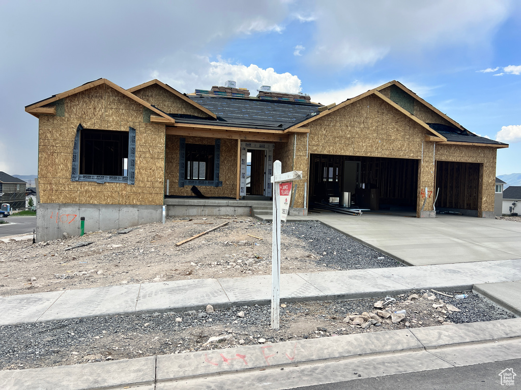 Property under construction featuring a garage