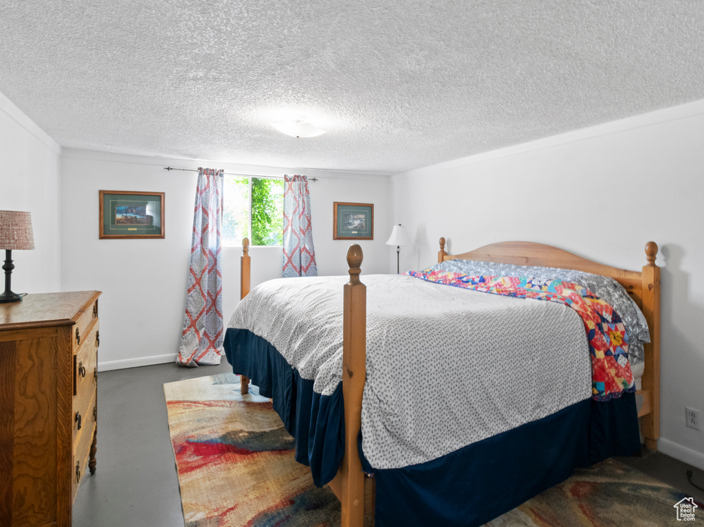 Bedroom featuring a textured ceiling