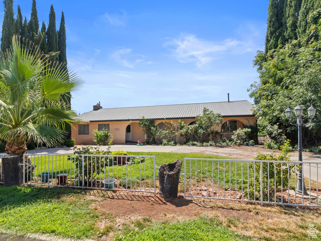 Single story home with central AC and a front lawn