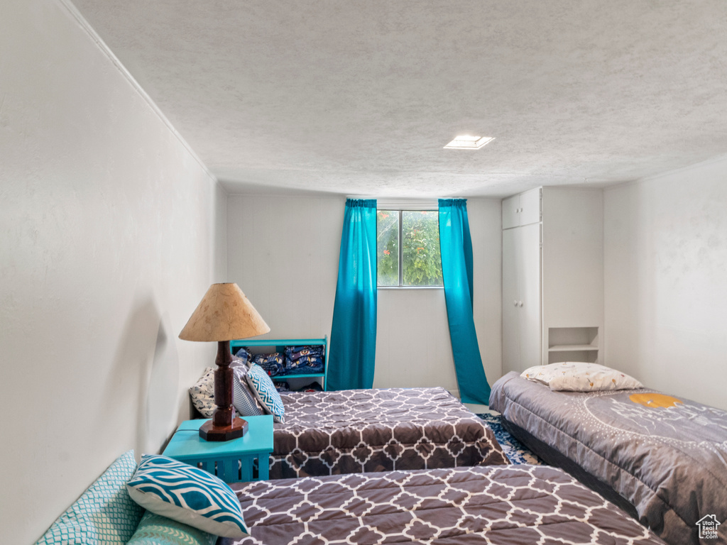 Bedroom with a textured ceiling