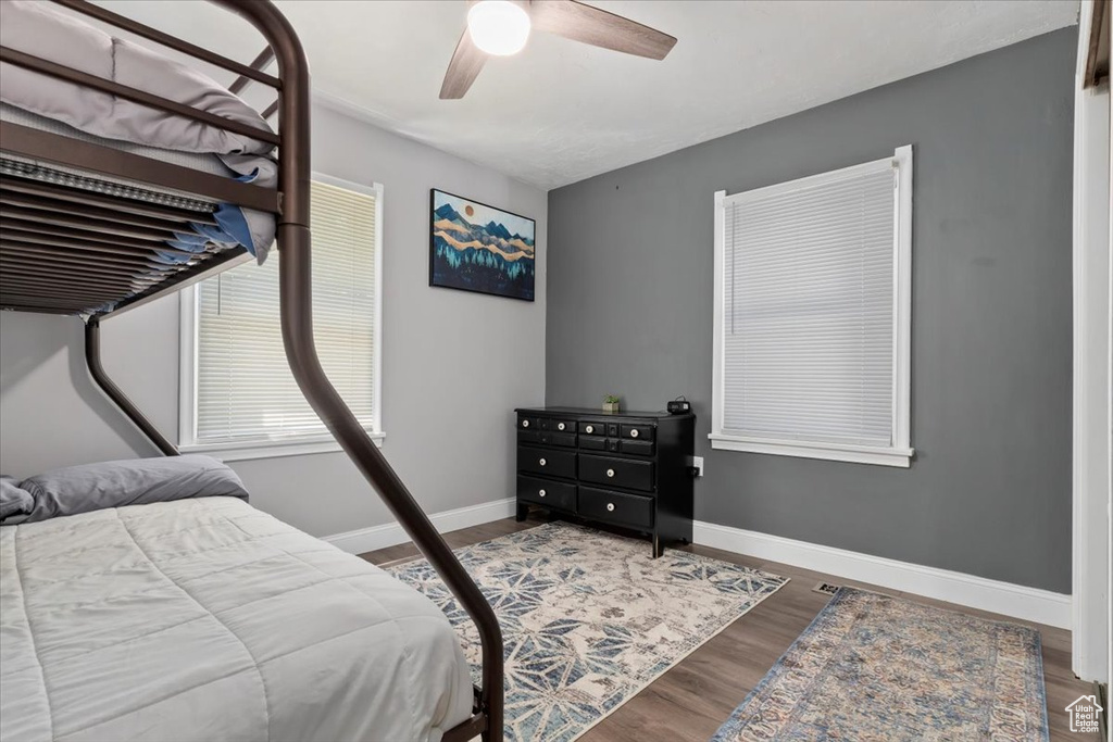 Bedroom featuring ceiling fan and hardwood / wood-style floors