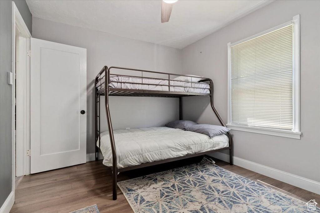 Bedroom featuring ceiling fan and wood-type flooring