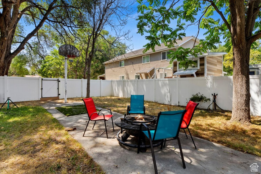 View of patio / terrace with a fire pit