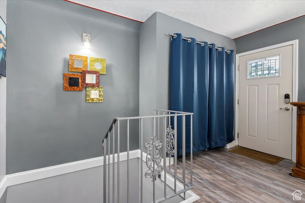 Foyer with hardwood / wood-style flooring