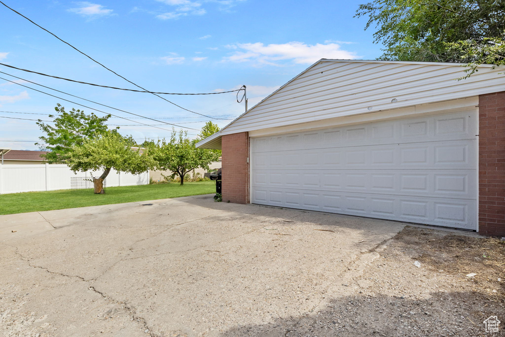 Garage featuring a yard