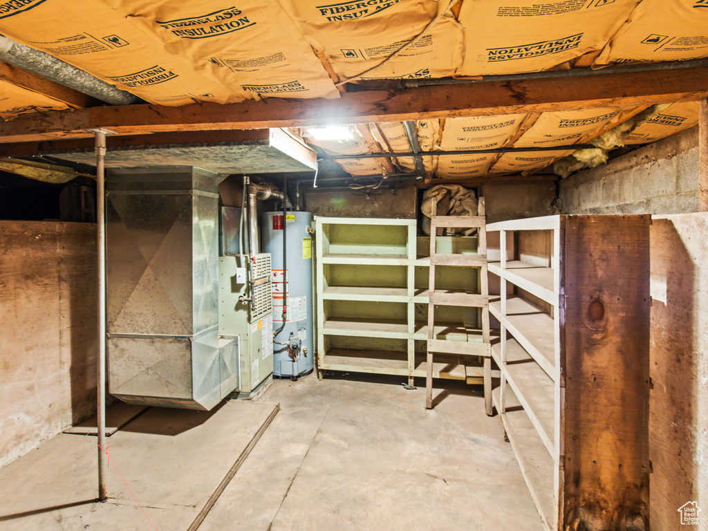 Basement featuring water heater